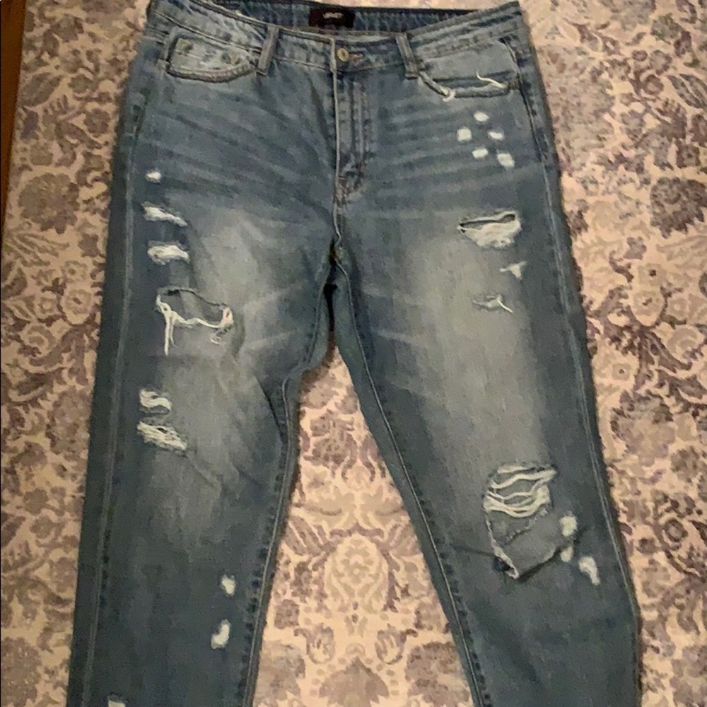 Distressed jeans ripped